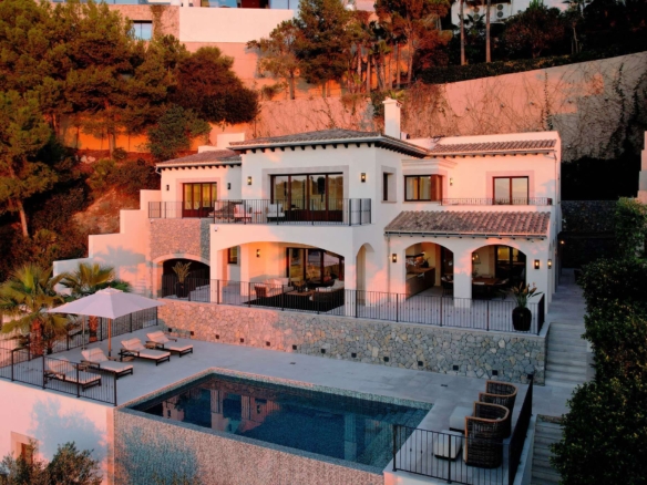 Luxury frontline villa exterior in Cala Llamp, Puerto Andratx, Mallorca — modern Mediterranean architecture with private pool and sea views
